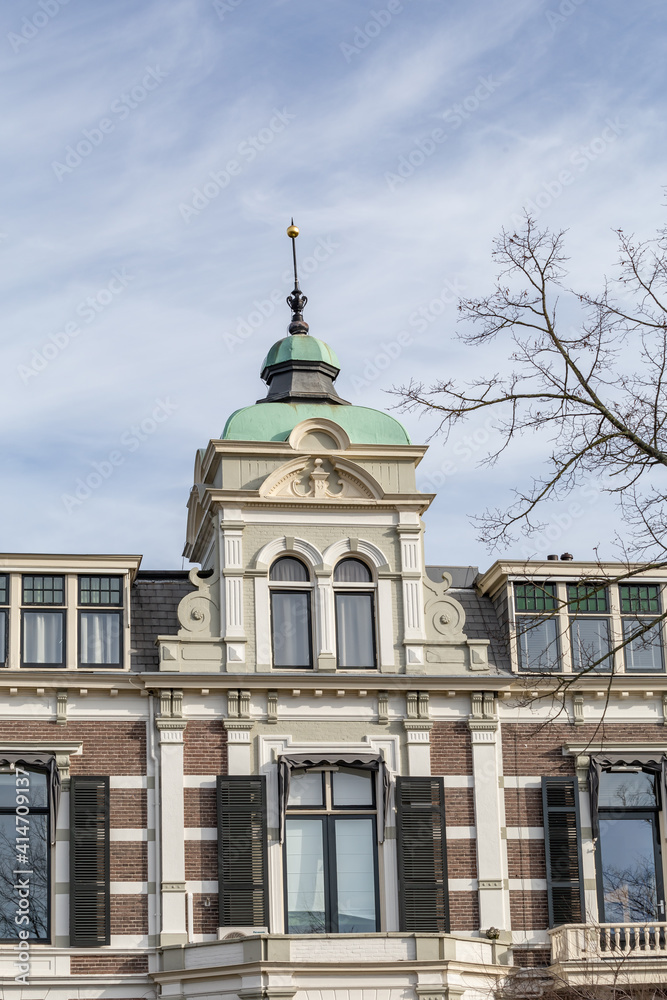 Dutch city Gable house with shutter windows and and tower in Deventer in the Netherlands Dutch city Gable house with shutter windows and and tower in Deventer in the Netherlands
