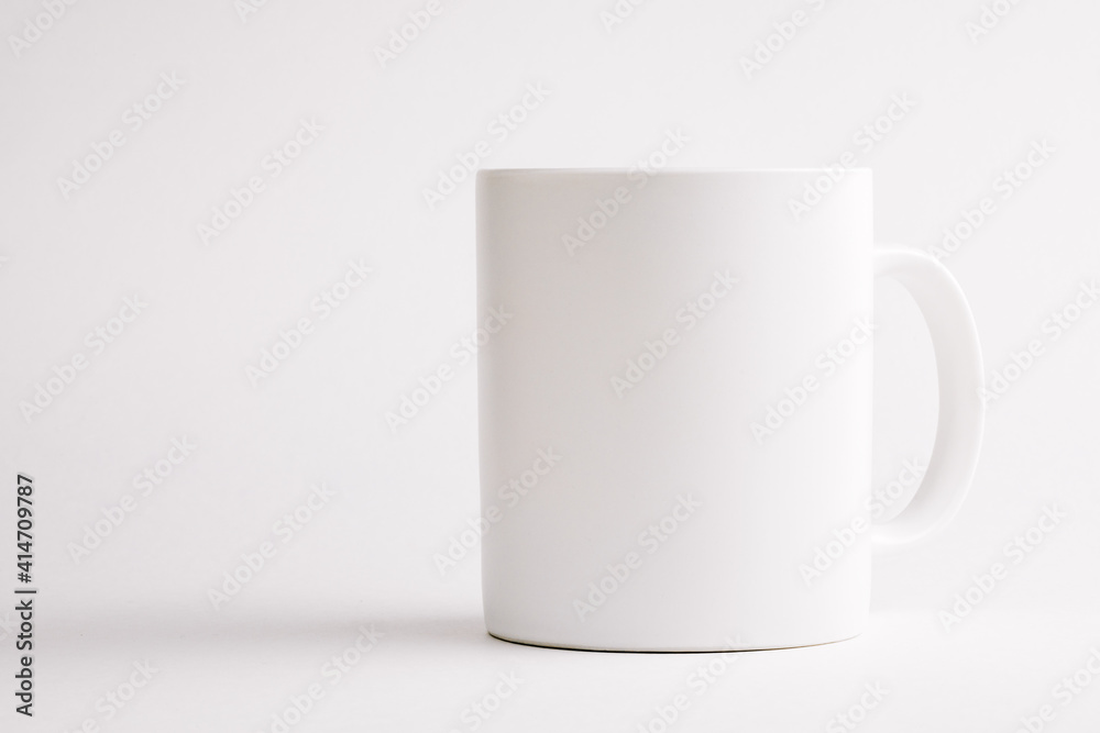 White ceramic cup on white background. White ceramic cup on white background.