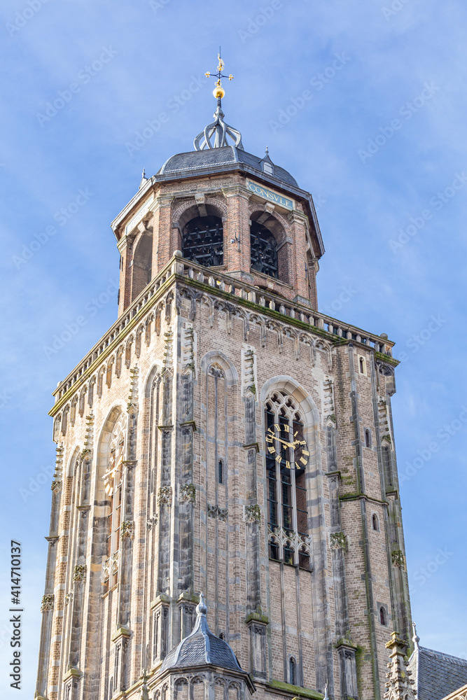 Closeup of the ancient tower of the great church in the medieval centre of Deventer in Overijssel in the Netherlands