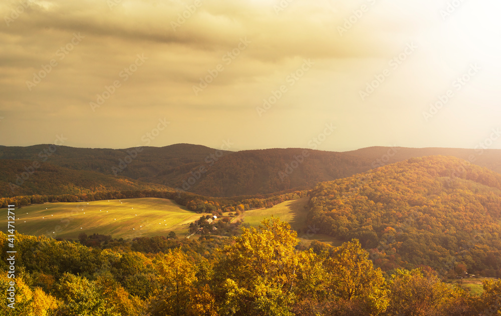 Green hilly landscape during autumn.