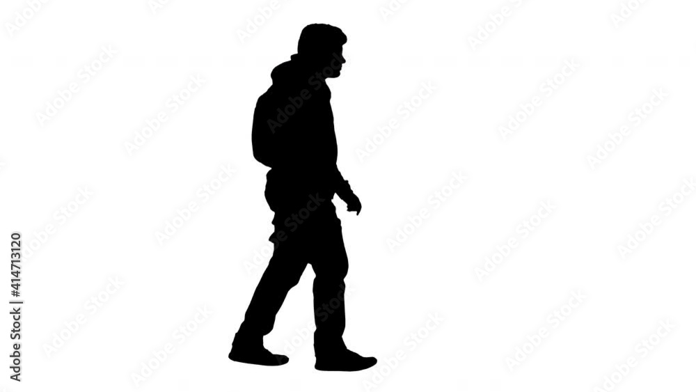 Silhouette School boy in casual clothes walking and taking off medical mask. Silhouette School boy in casual clothes walking and taking off medical mask.