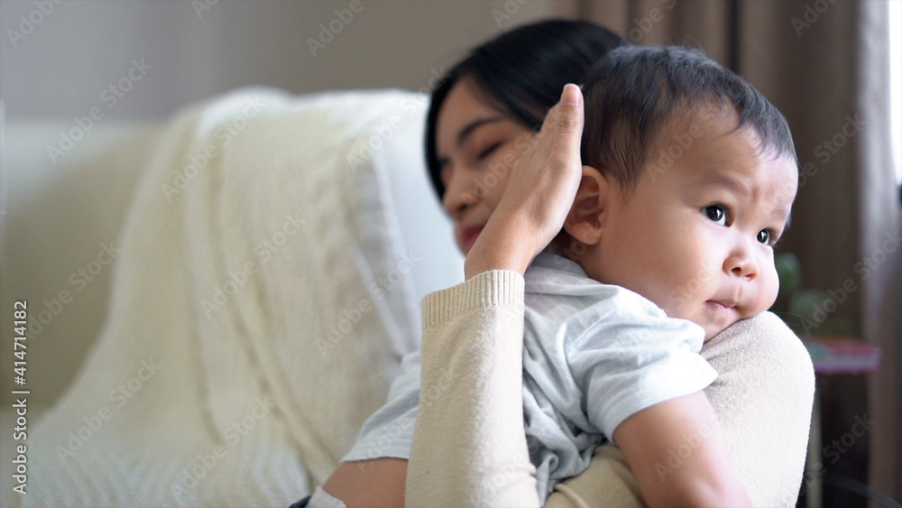Asian cute boy kid hugging, embracing his mom. Asian cute boy kid hugging, embracing his mom.