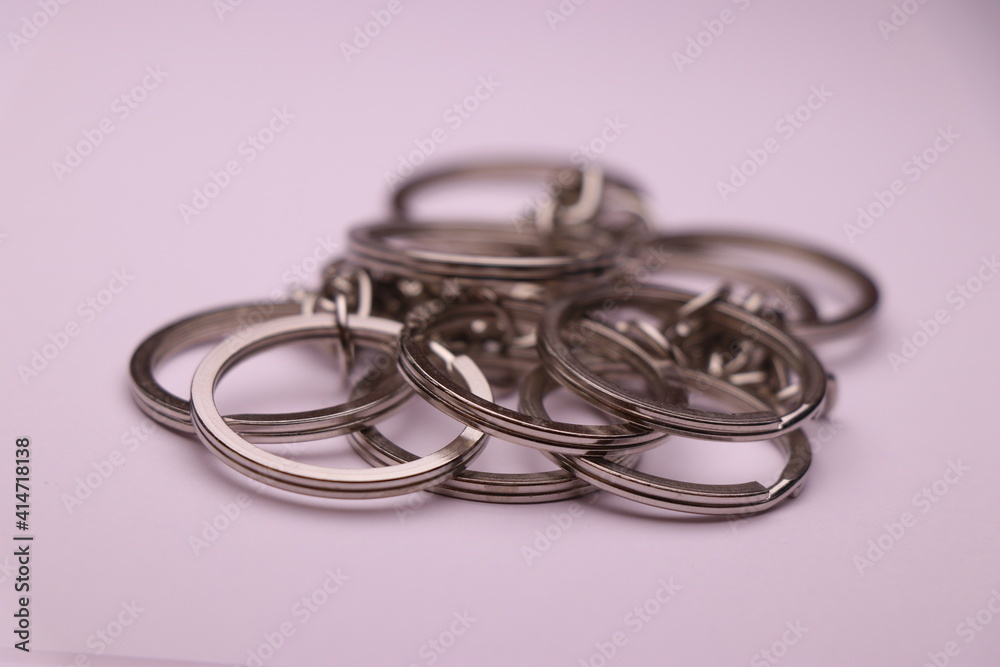 Fototapeta premium Closeup of split keyring with chain on white background