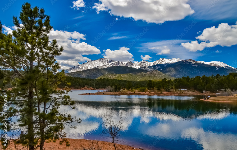 Panorama Snow-capped and forested mountains near a mountain lake, Pikes Peak Mountains in Colorado Spring, Colorado, US Panorama Snow-capped and forested mountains near a mountain lake, Pikes Peak Mountains in Colorado Spring, Colorado, US