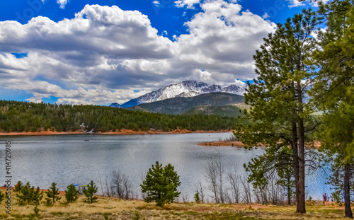 Panorama Snow-capped and forested mountains near a mountain lake  Pikes Peak Mountains in Colorado Spring  Colorado  US