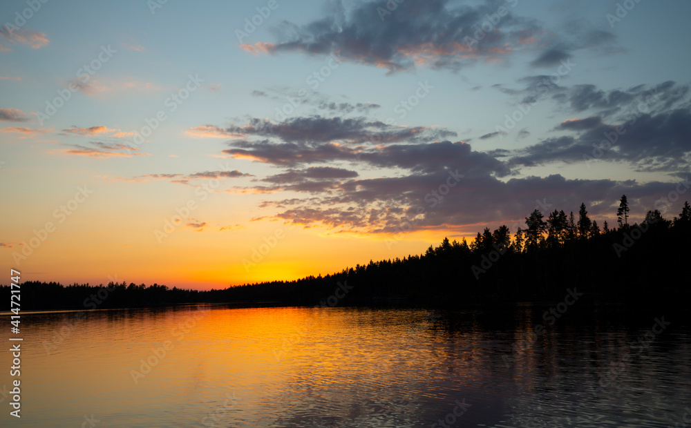 Beautiful sunset over a calm lake in dalarna, sweden Beautiful sunset over a calm lake in dalarna, sweden