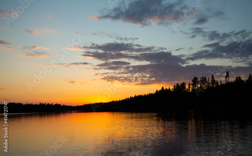 Beautiful sunset over a calm lake in dalarna, sweden