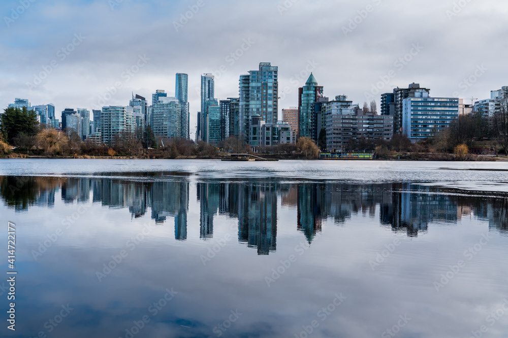 Vancouver downtown reflections in frozen lake with winter backgrounds Vancouver downtown reflections in frozen lake with winter backgrounds