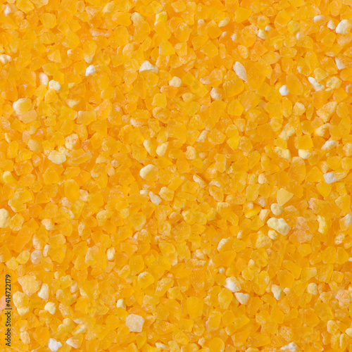 raw crushed corn groats close up