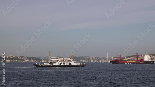 Istanbul Bosporus and 15 Temmuz Sehitler Bridge timelapse along with local ships, small boats, ferryboats, commercial ships passing on the sea Sea gulls are flying photo