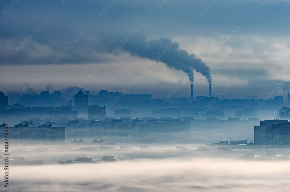 Fototapeta premium Plant emits smoke smog chimneys in cloudy fog, pollutants released into atmosphere. Ecological catastrophy, harmful emissions and exhaust fumes. Chemical industry against the sky.