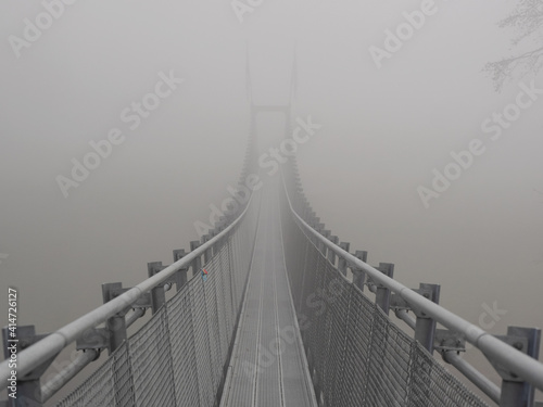 Fototapeta Naklejka Na Ścianę i Meble -  Suspension bridge in the fog