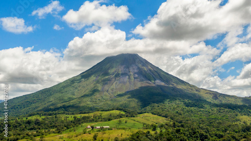 Amazing view of beautiful nature of Costa Rica with smoking volcano Arenal background. Panorama of volcano Arenal reflected on wonderful picturesque lake  La Fortuna  Costa Rica. Central America.