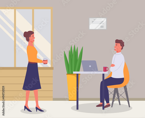 A woman comes to a colleague in the office during a break to talk, businessman dressed in formal clothes is sitting at the table with laptop. Office workers discussing matters. Friendly team work