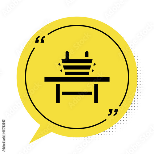 Black Sauna bench with bucket icon isolated on white background. Yellow speech bubble symbol. Vector.