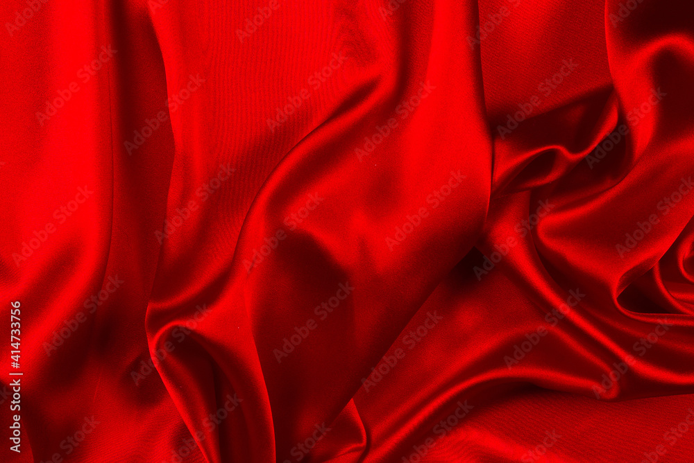 Red silk or satin luxury fabric texture can use as abstract background. Top view. Red silk or satin luxury fabric texture can use as abstract background. Top view.