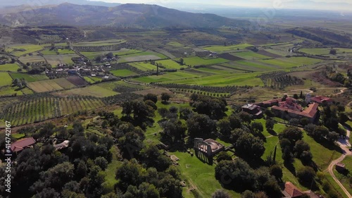 View from drone of ancient ruins, monastery and beautiful, green fields photo