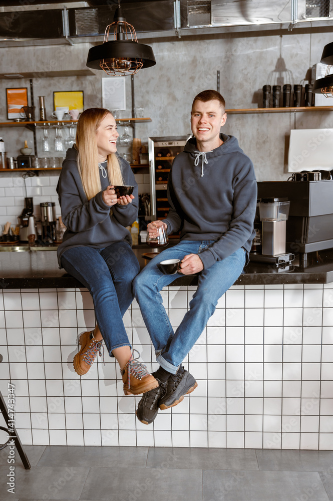 Happy smiling professional barista in cafe