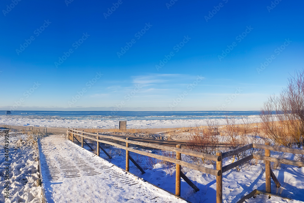 Panorama of winter Baltic Sea with snow on sunny day in Riga, Latvia. Baltics in winter.