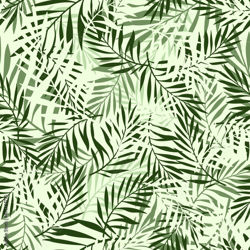 Green texture with palm leaves. Vector seamless pattern.