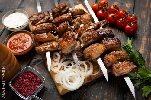 barbecue lamb ribs on cutting board on wooden table