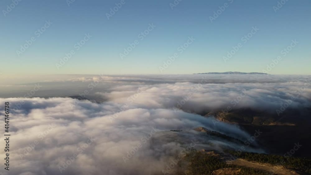 Mountain forest with low clouds and fog between the trees and peaks Mountain forest with low clouds and fog between the trees and peaks