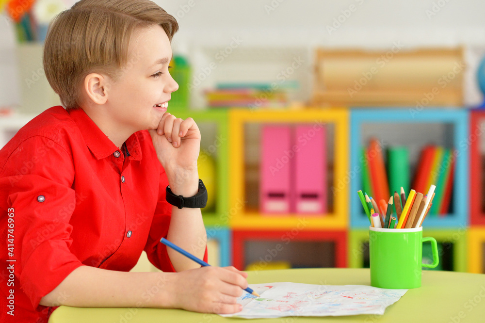 Portrait of cute little boy drawing with pencils Portrait of cute little boy drawing with pencils
