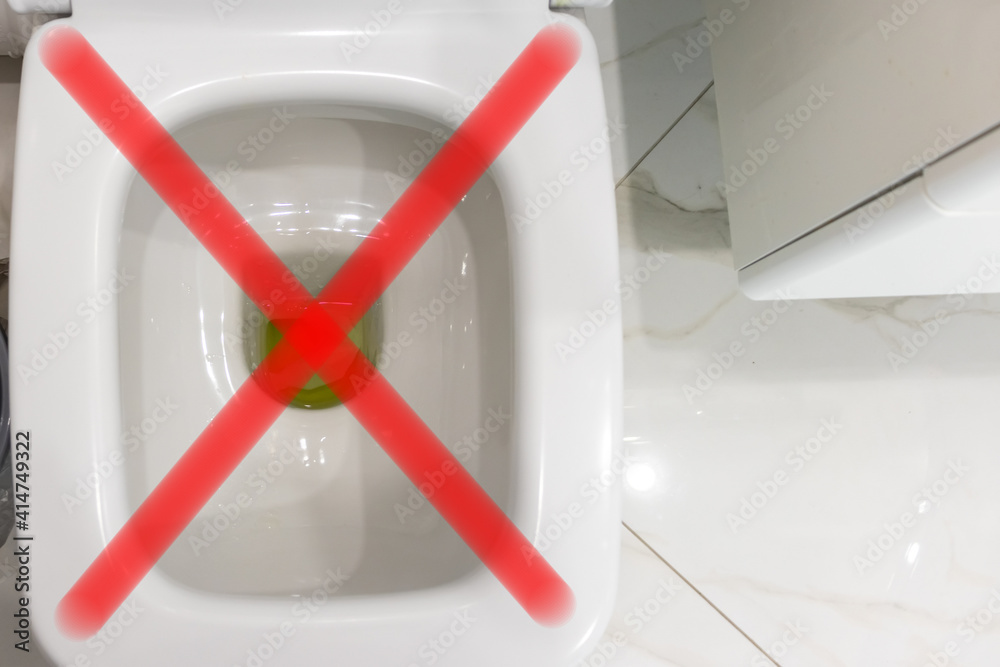 toilet bowl closeup with unwashed liquid. the clog in the toilet Stock