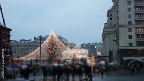 Big carousel panoramic shot on the Red Square in Moscow.Christmas market and decorations in city.Big christmas tree on Manezhnaya Square.Tverskaya street on back