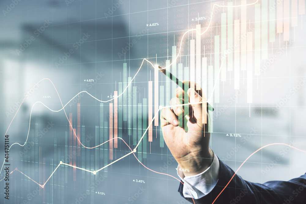 Multi exposure of businessman hand with pen working with virtual creative financial chart hologram on blurred office background, research and analytics concept Multi exposure of businessman hand with pen working with virtual creative financial chart hologram on blurred office background, research and analytics concept