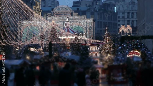 Big carousel on the Red Square in Moscow.Christmas market and decorations in city.Big christmas tree on Manezhnaya Square.Tverskaya street on back