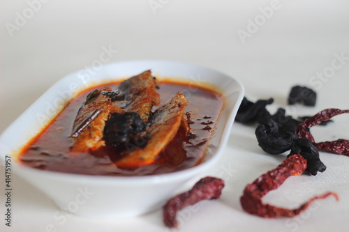 Sardines curry is a traditional central Kerala fish curry also known as mathi curry. photo