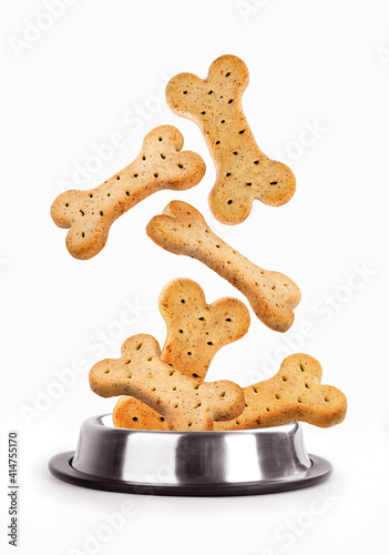 biscuit bone for dogs falls in a plate