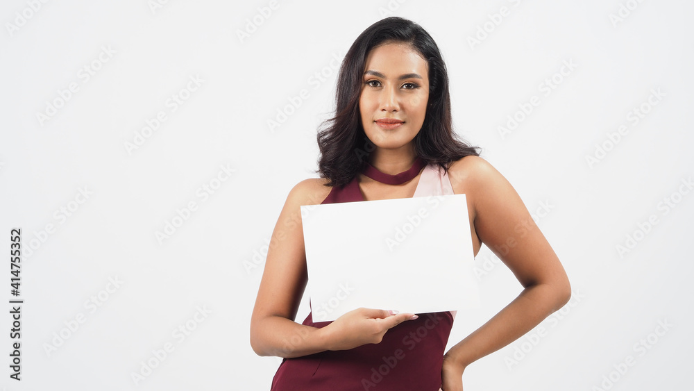 Asian beautiful young woman holding empty blank paper. A studio portrait with white background .Empty Space for text .She have tan skin. Asian beautiful young woman holding empty blank paper. A studio portrait with white background .Empty Space for text .She have tan skin.