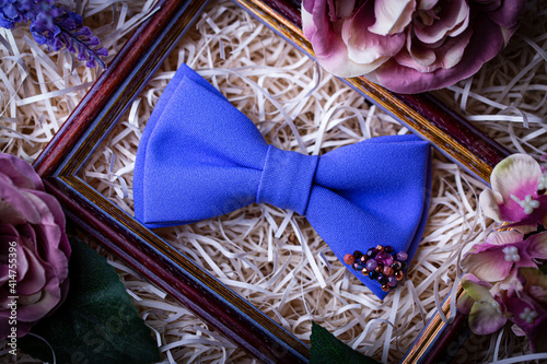 Handmade blue bow tie in creative packaging