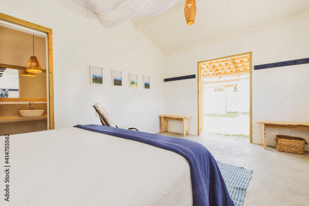 Modern luxury summer holiday or vacation wooden beach house bedroom