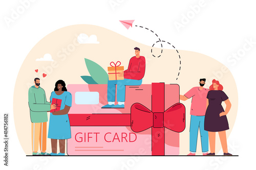 Tiny people near giant gift card voucher from store flat vector illustration. Cartoon happy customers getting coupon during shopping. Discount program and retail concept