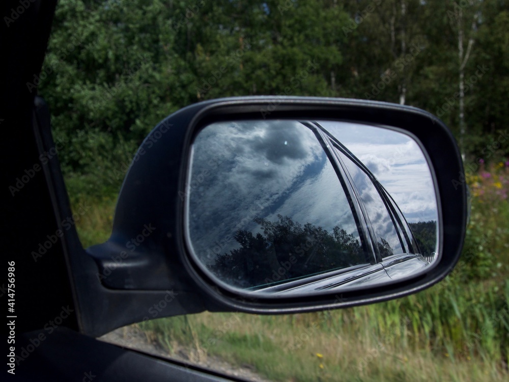 rearview car driving mirror view green forest road