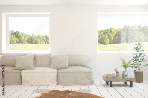 White living room with sofa and summer landscape in window. Scandinavian interior design. 3D illustration