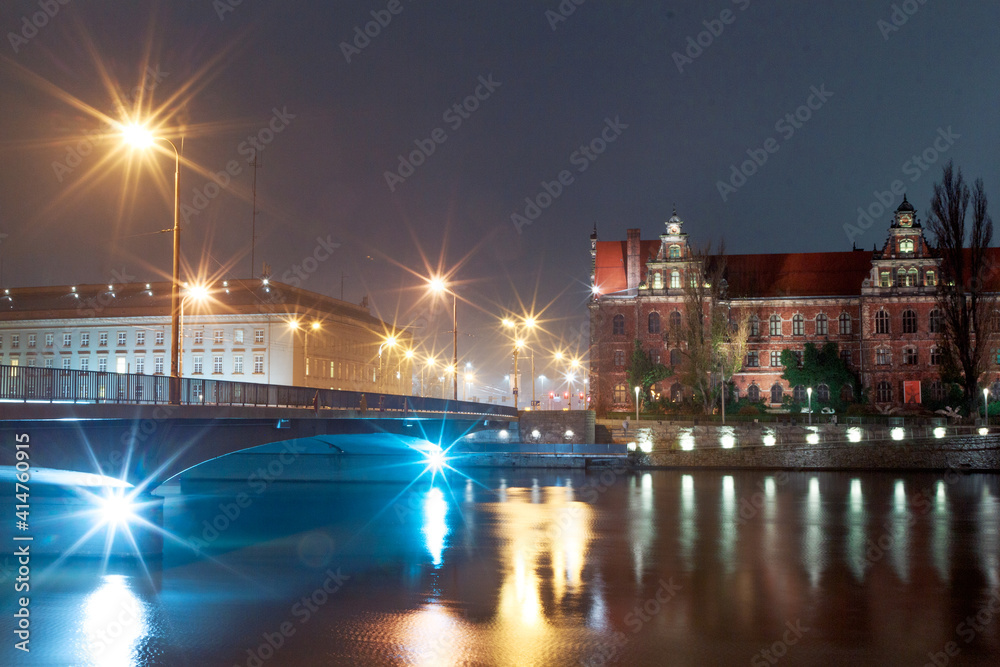 view of the river and buildings on the banks of the odra river in wroclaw in poland
