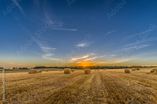 A sunset over meadow at harvest time, Belarus