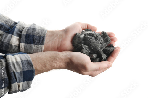 Man holding coal in hands on white background, closeup