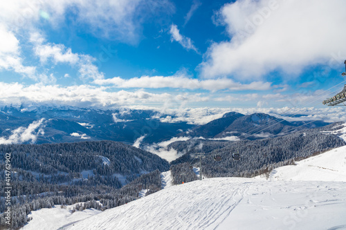 Wallpaper Mural Beautiful snow landscape of snowy trees and ski lift of Roza Khutor ski resort. South part of mountains with sunny weather. Sochi, Russia. Torontodigital.ca