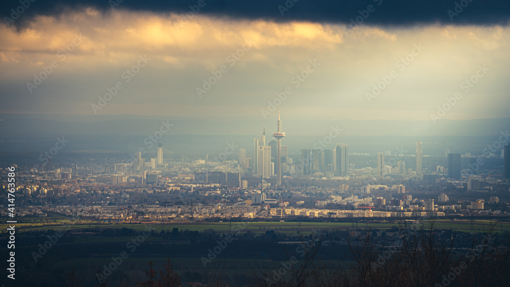 The skyline of the financial district of Frankfurt at sunset blue hour with fantastic sky and clouds