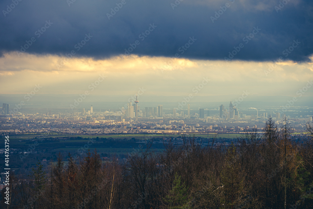 Fototapeta premium The skyline of the financial district of Frankfurt at sunset blue hour with fantastic sky and clouds