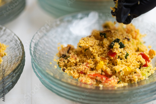 Sicilian recipe vegetable Tabulè, a salad based on cold couscous seasoned with lots of vegetables
