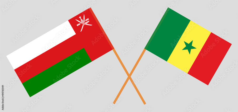Crossed flags of Oman and Senegal