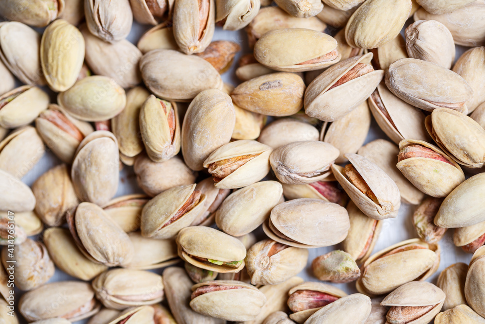 Delicious fried in shell salted pistachio nuts, they are healthy and contain vitamins Delicious fried in shell salted pistachio nuts, they are healthy and contain vitamins