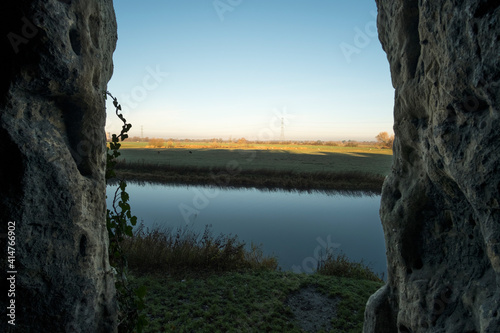 Landscape as seen from inside a cave photo