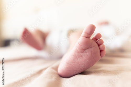 New born foot close up with blurred background
